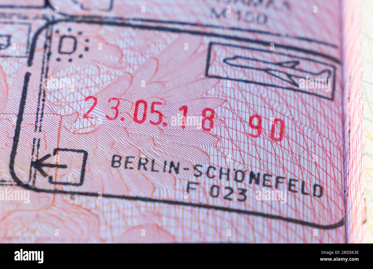 Germany Berlin border crossing stamp in an open passport. Berlin