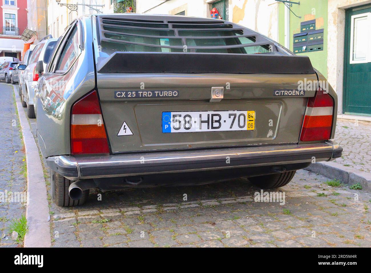 A classic Citroen CX 25 TRD Turbo Series 1, parked offroad and squatting down on its lowest hydraulic suspension setting, Lisbon, Portugal, April 2023. Stock Photo