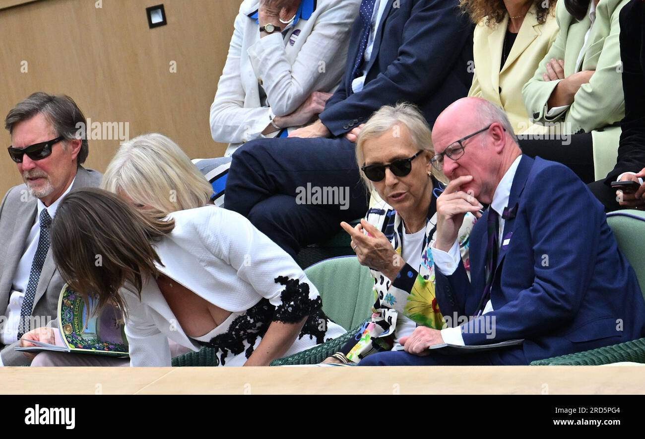 London, Gbr. 14th July, 2023. London Wimbledon Championships Day 13 15/07/2023 Ms Martina Naratilova's guest Ms Julia Lemigova reaches for the sweeties in front of AELTC Chairman Ian Hewitt and raised complaints about her low cut dress being 'inappropriate in the Royal Box Credit: Roger Parker/Alamy Live News Stock Photo