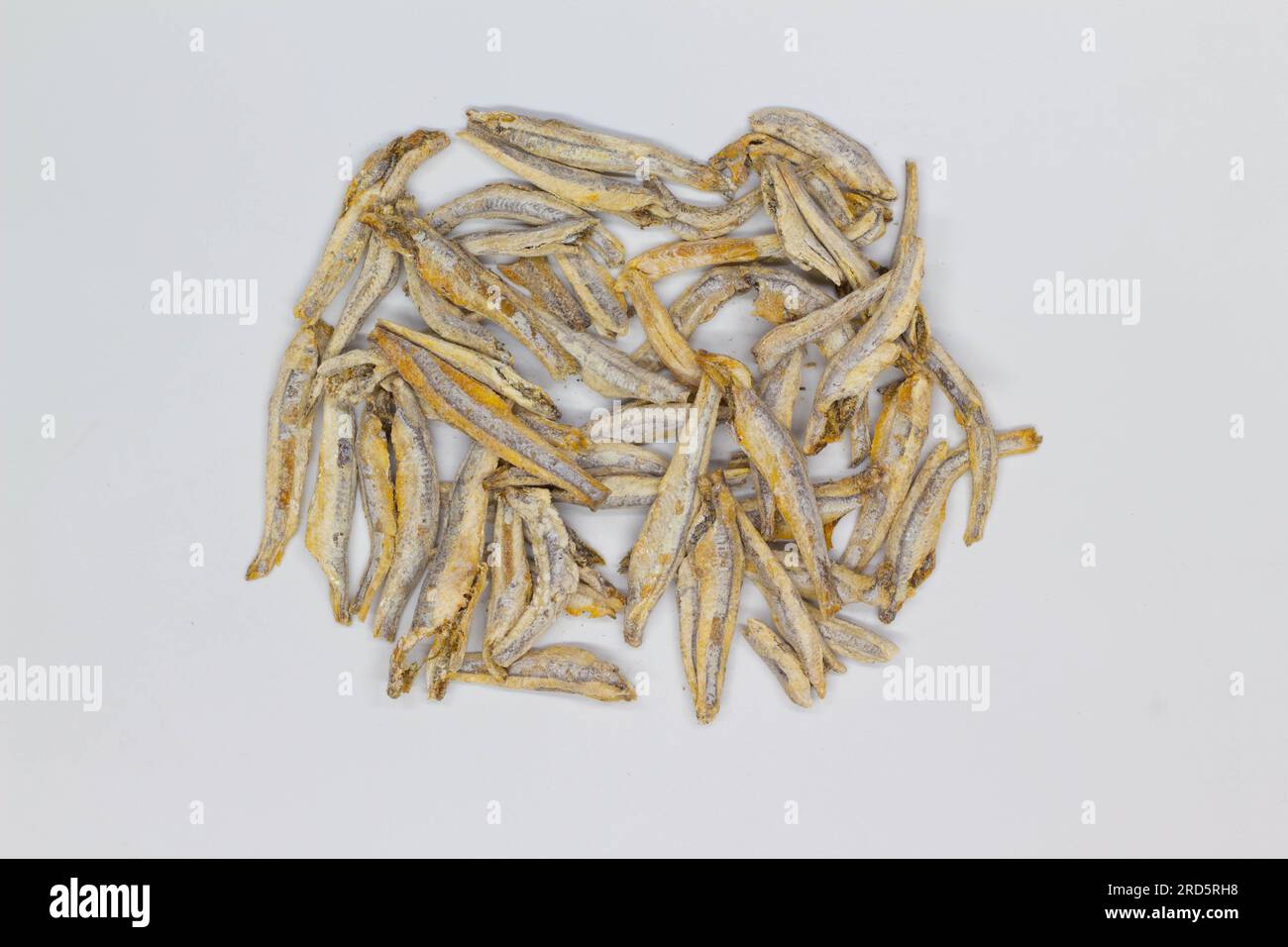 Dried anchovies on a white background. Isolated. Сloseup. Top view