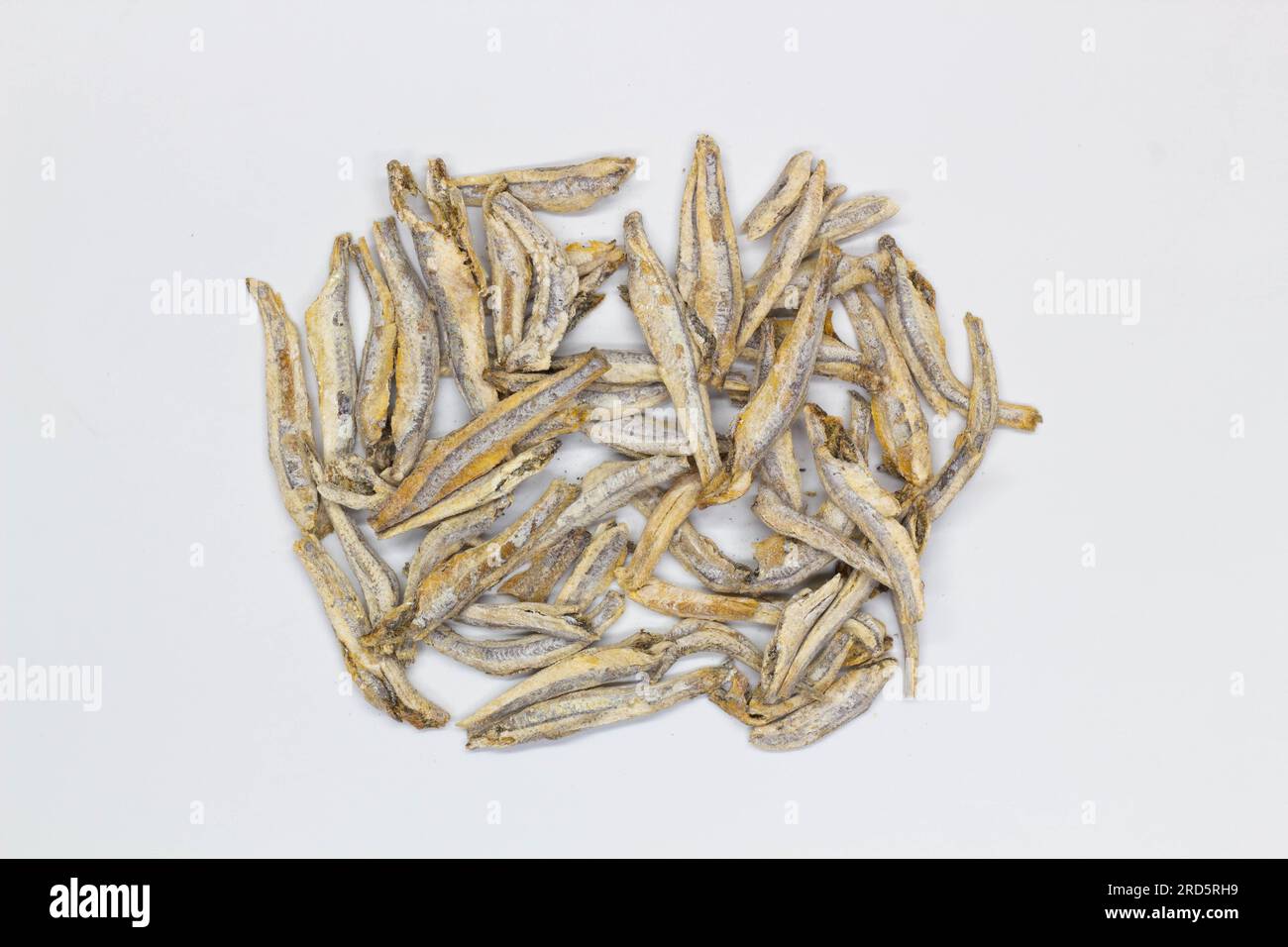 Dried anchovies on a white background. Isolated. Сloseup. Top view
