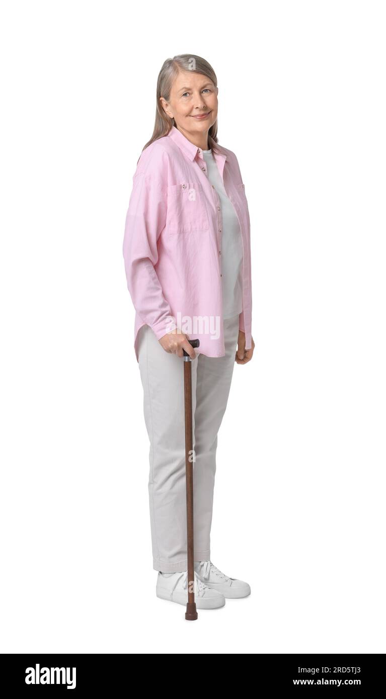 Senior woman with walking cane on white background Stock Photo - Alamy