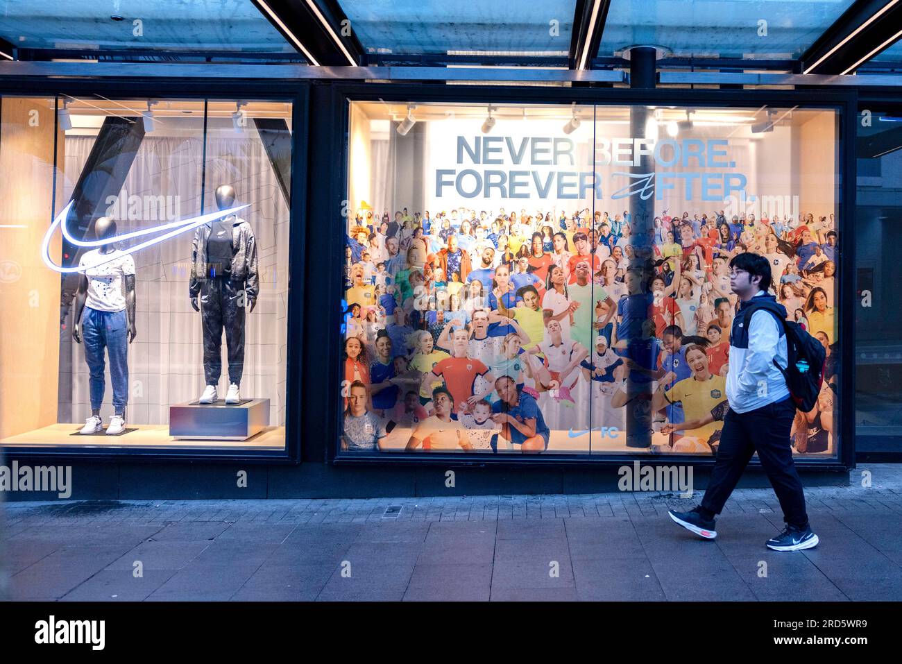 Auckland, New Jersey, New Zealand. 19th July, 2023. A pedestrian walks past  a display in the Nike store window with images from the players in the 2023  FIFA Women's World Cup and