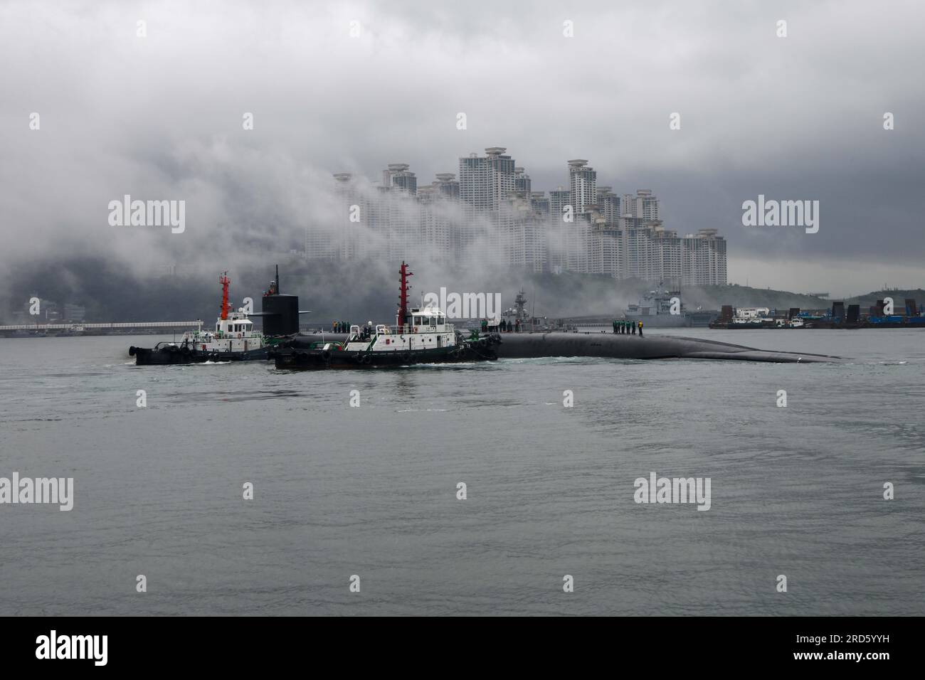 230718-N-ZU710-0046 BUSAN, Republic of Korea (July 18, 2023) - The Ohio-class ballistic-missile submarine USS Kentucky (SSBN 737) pulls into port in Busan. Homeported in Naval Base Kitsap, Bangor, Washington, Kentucky is a launch platform for submarine-launched ballistic missiles, providing the United States with its most survivable leg of the nuclear triad. The visit represents the United States’ ironclad commitment to the Republic of Korea (ROK) for its extended deterrence guarantee, and compliments the many exercises, training, operations, and other military cooperation activities conducted Stock Photo