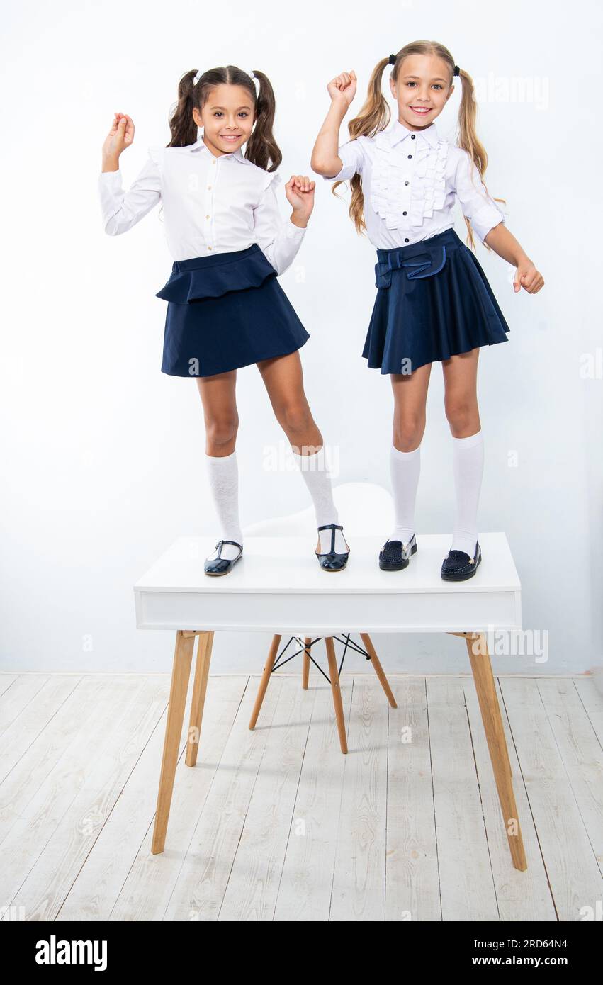 two girls in school uniform. education and knowledge. children girls