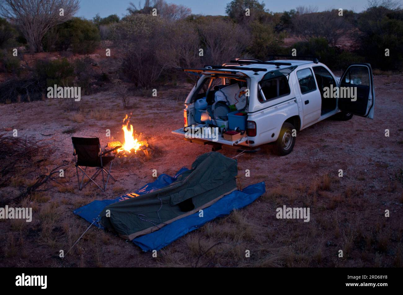 Free camping with swag, campfire and truck set up for the night
