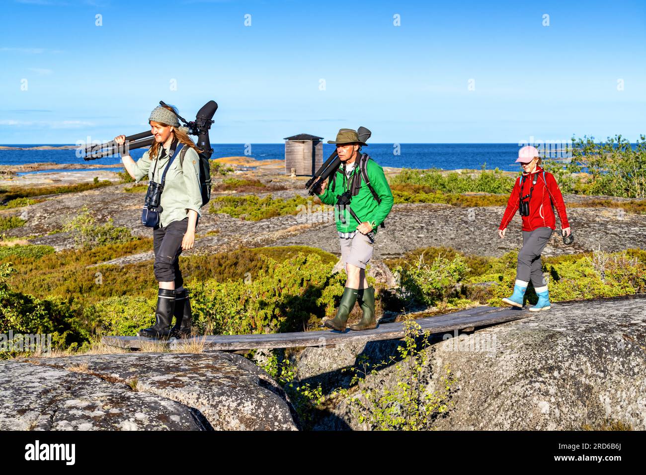 Bird watchers at Lågskär lighthouse island, Ahvenanmaa, Finland Stock Photo