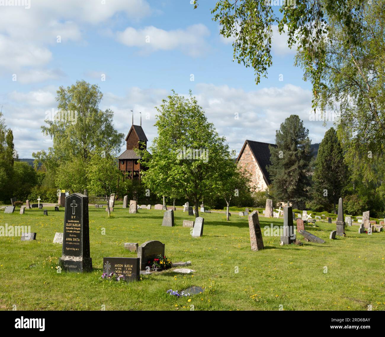RAGUNDA, SWEDEN ON JUNE 07, 2023. View of the cemetery, headstones, belfry, and the old church. Morning. Editorial use. Stock Photo