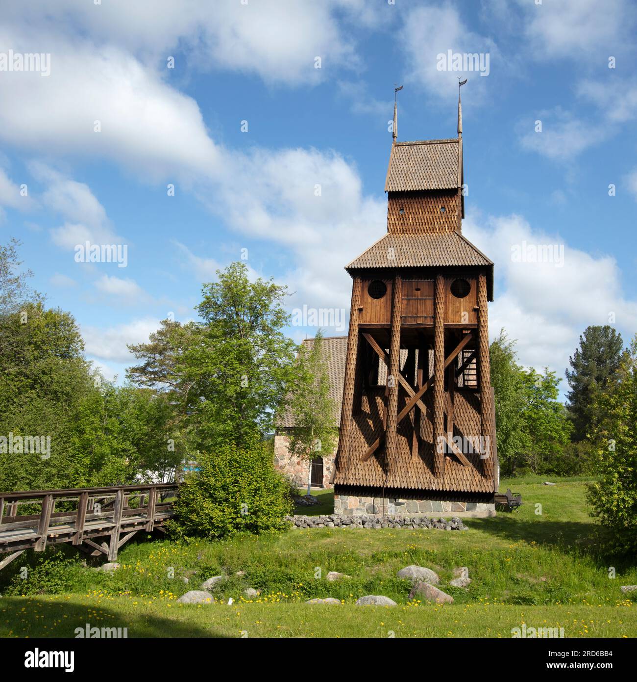 RAGUNDA, SWEDEN ON JUNE 07, 2023. View of a bridge, a traditional wooden belfry, and an old church. Editorial use. Stock Photo