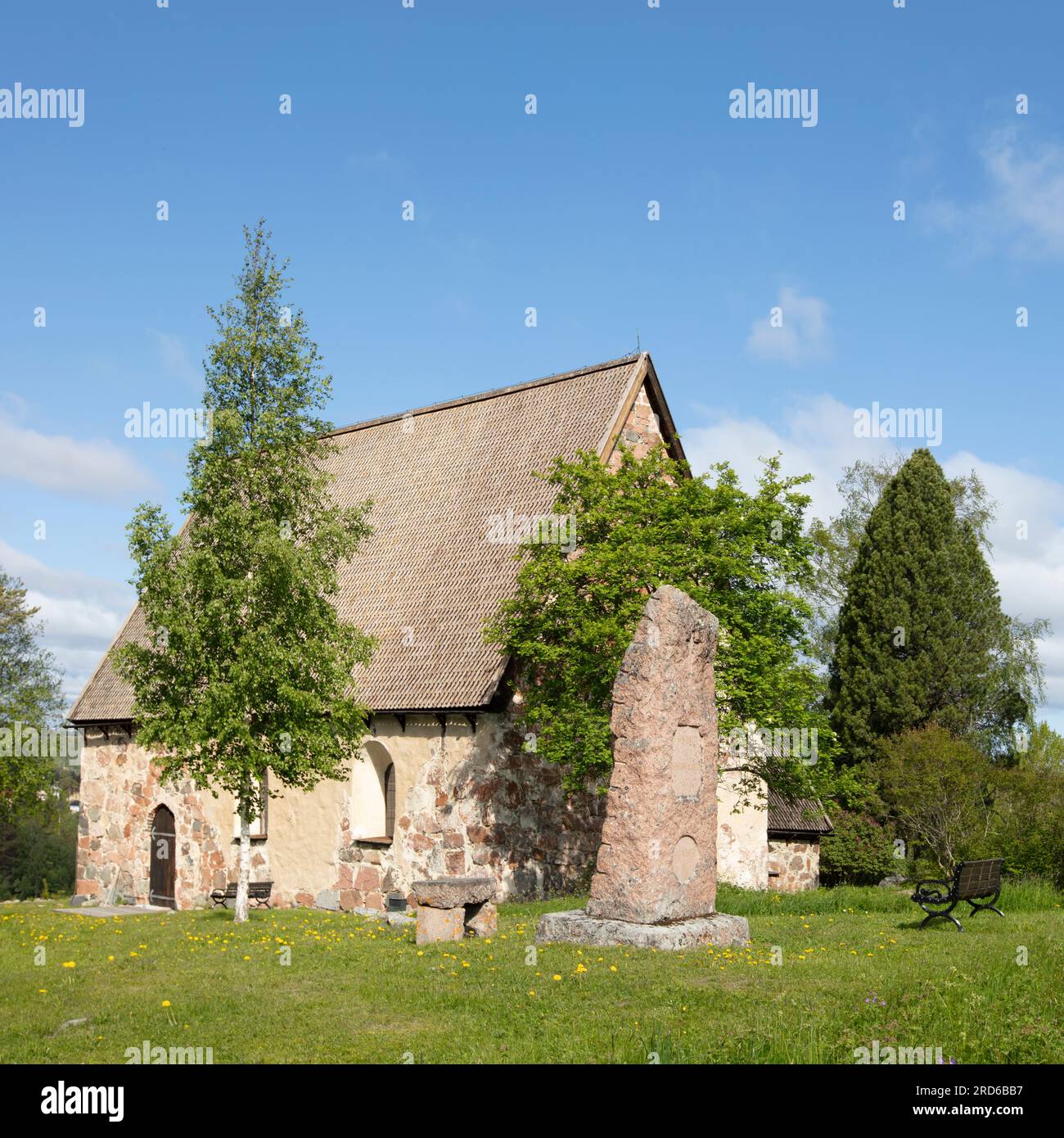 RAGUNDA, SWEDEN ON JUNE 07, 2023. View of the front of an old, traditional stone church. Built in the late 15th. Editorial use. Stock Photo