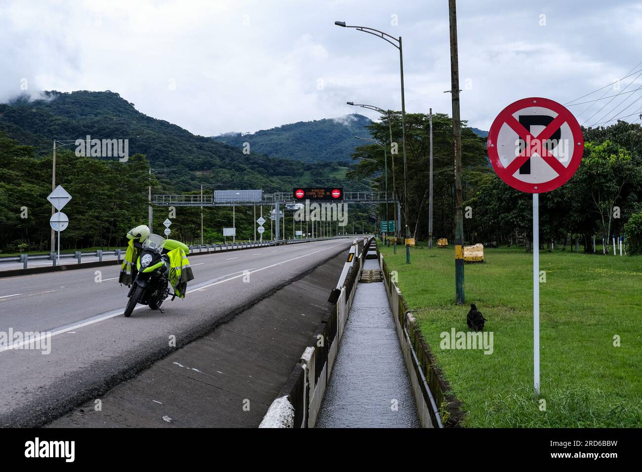 Bogota, Colombia. 18th July, 2023. A colombian police motorbike is seen  closing the Bogota - Villavicencio road after a landslide caused by heavy  rains left at least 14 people dead and about