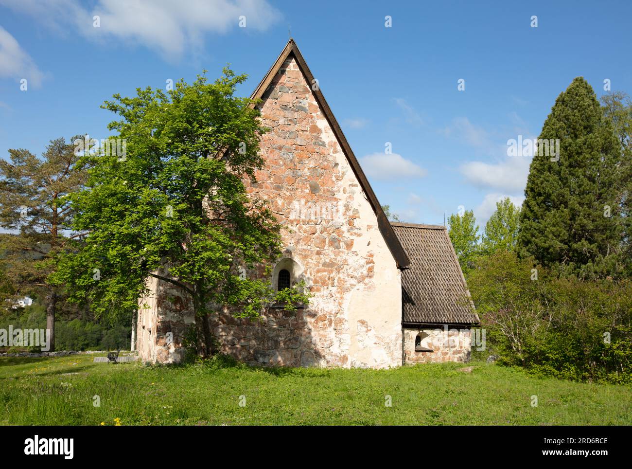 RAGUNDA, SWEDEN ON JUNE 07, 2023. View of an old stone church. Built-in the late 15th, the wall and surrounding. Editorial use. Stock Photo