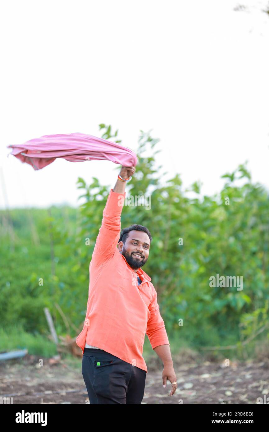 happy Indian farmer standing in green Chilli farm Stock Photo - Alamy