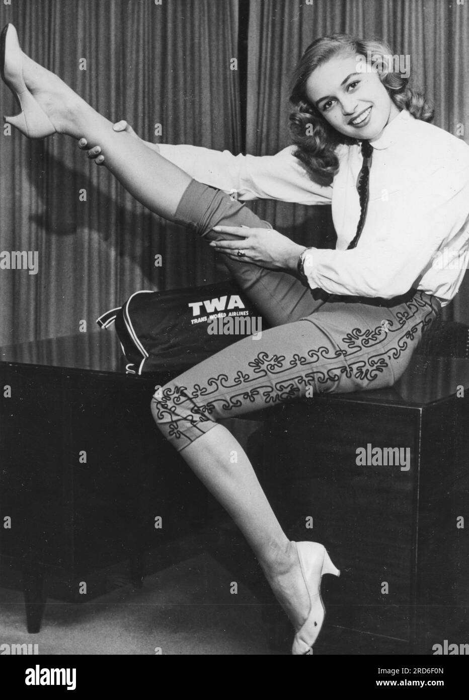 people, women, 1950s, German-born Gisela Wright (19) stretches her leg, ADDITIONAL-RIGHTS-CLEARANCE-INFO-NOT-AVAILABLE Stock Photo