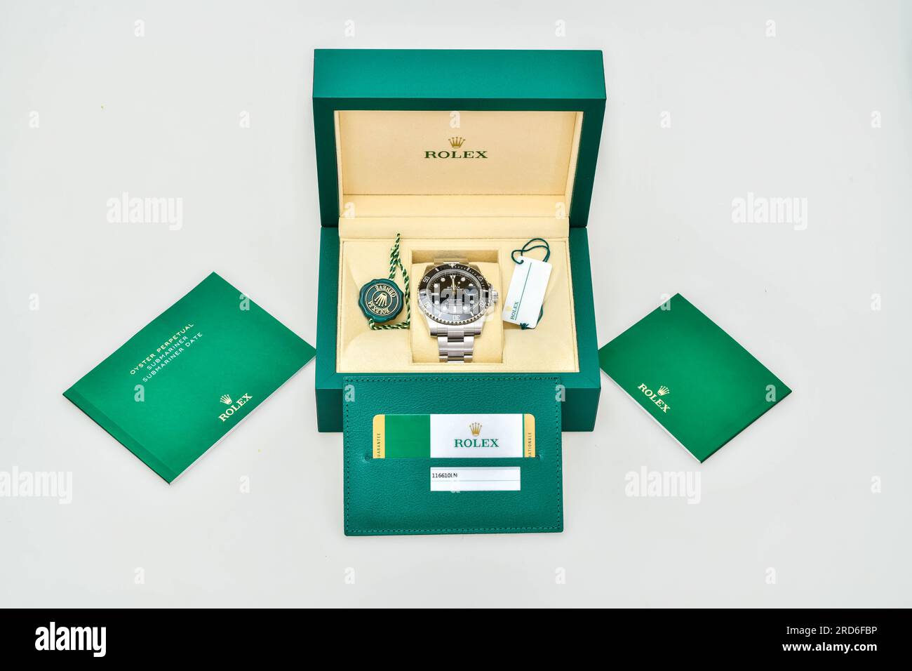 Bangkok Thailand- January 28,2021: Rolex Submariner Date Steel Black on Rolex green box crown logo , coin manual book Stock Photo