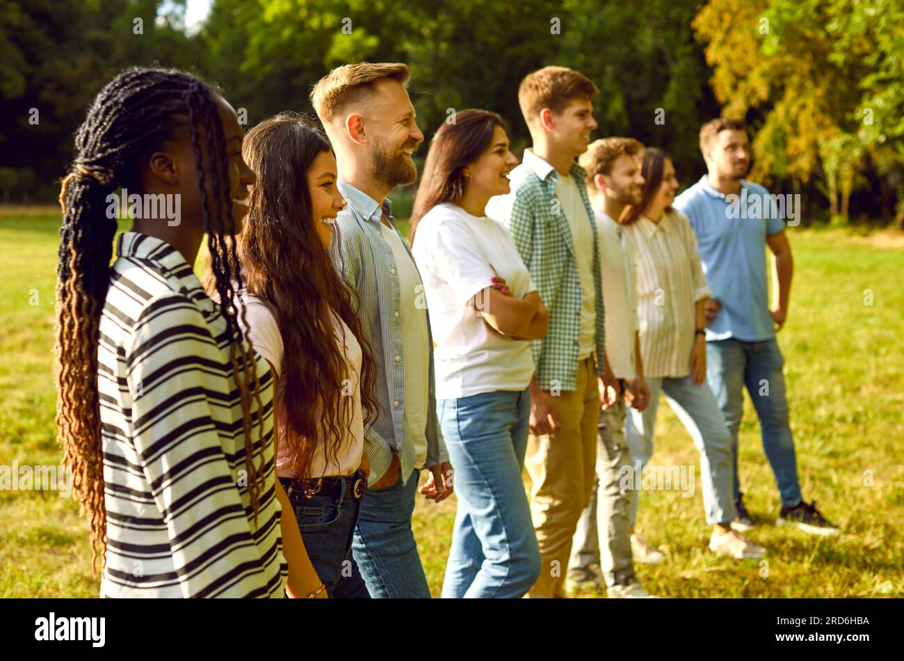 Group of happy young multiethnic men and women at an outdoor workshop ...
