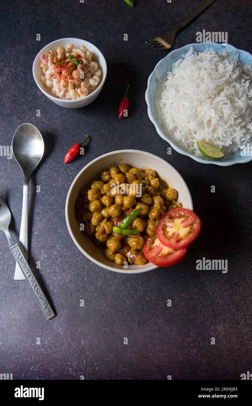 Chickpea masala in a bowl served with rice. Stock Photo