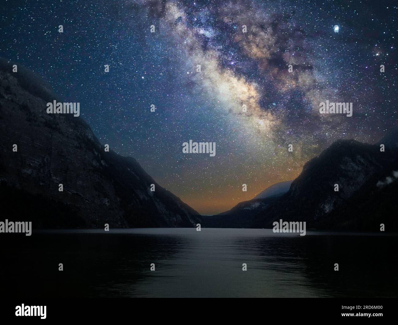 Milky Way galaxy with stars in the night sky with mountain and lake ...