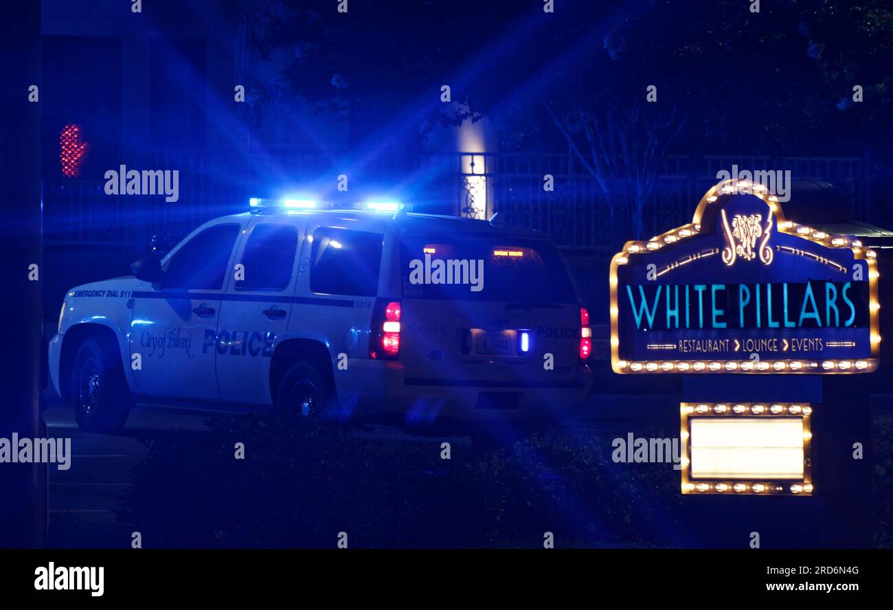 Biloxi Police Department officers search a vehicle in the White Pillars
