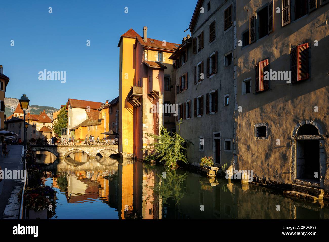 Old buildings reflected in Le Thiou flowing through old town Annecy Haute-Savoie Auvergne-Rhone-Alpes France Stock Photo