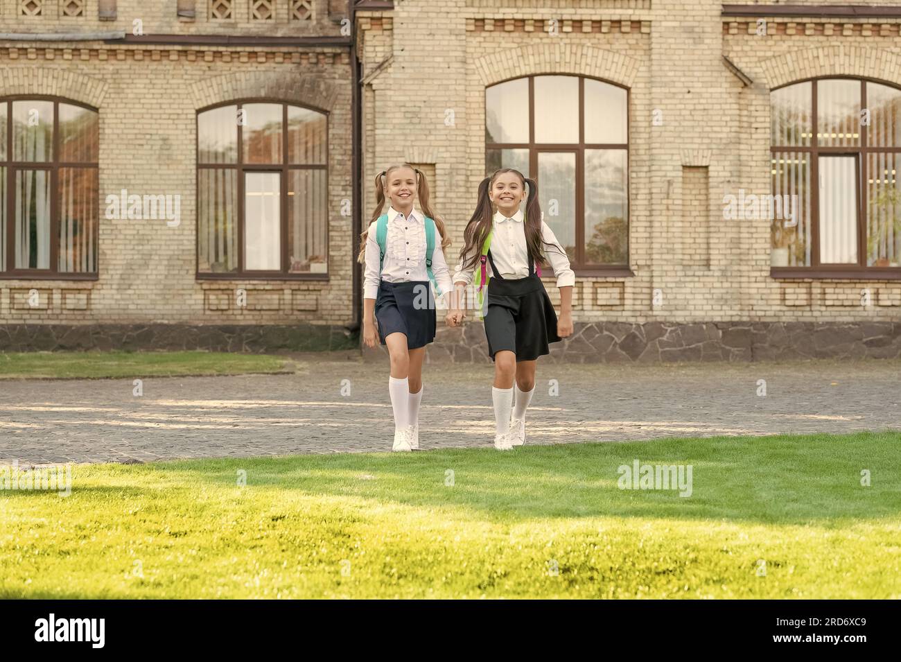 Two girls walk school in hi-res stock photography and images - Alamy