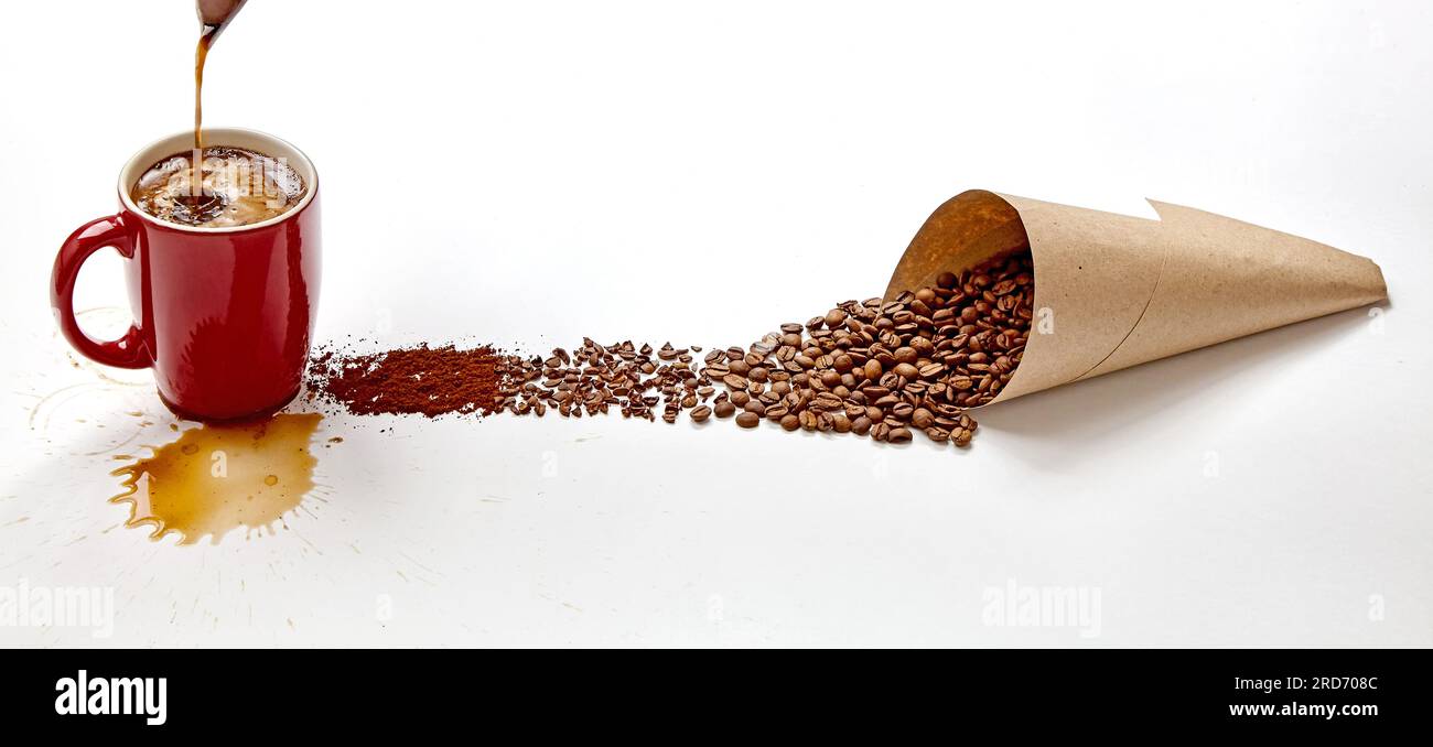 Red cup with pouring coffee and splashes and craft paper bag with ...