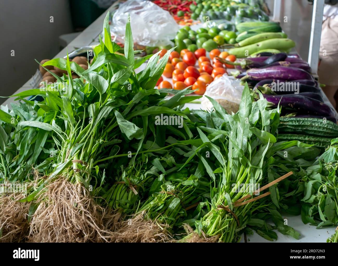 A pile of water spinach (Ipomoea aquatica), and othes vegetables in traditional market in Yogyakarta, Indonesia Stock Photo