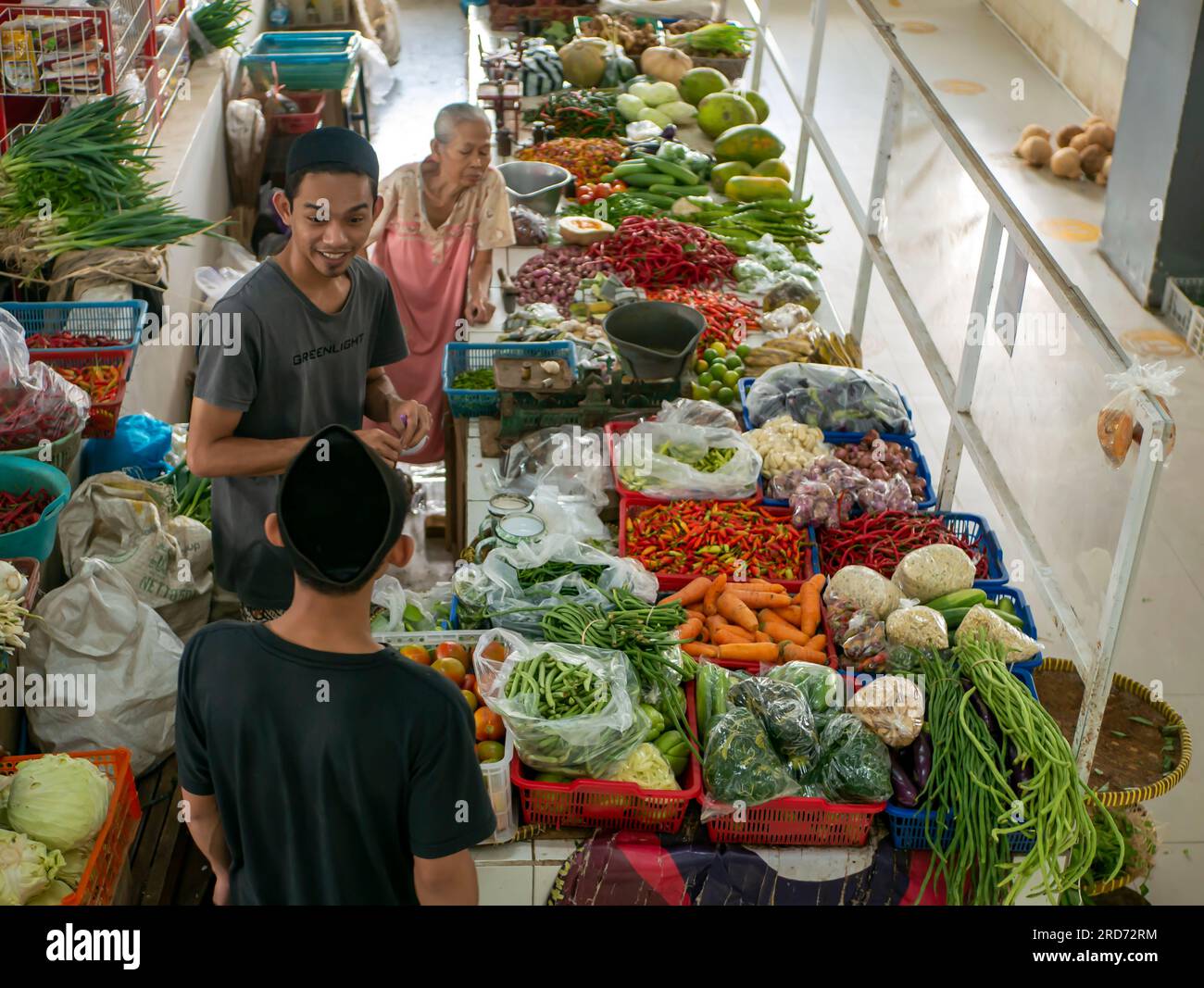 Young man selling vegetables hi-res stock photography and images - Alamy