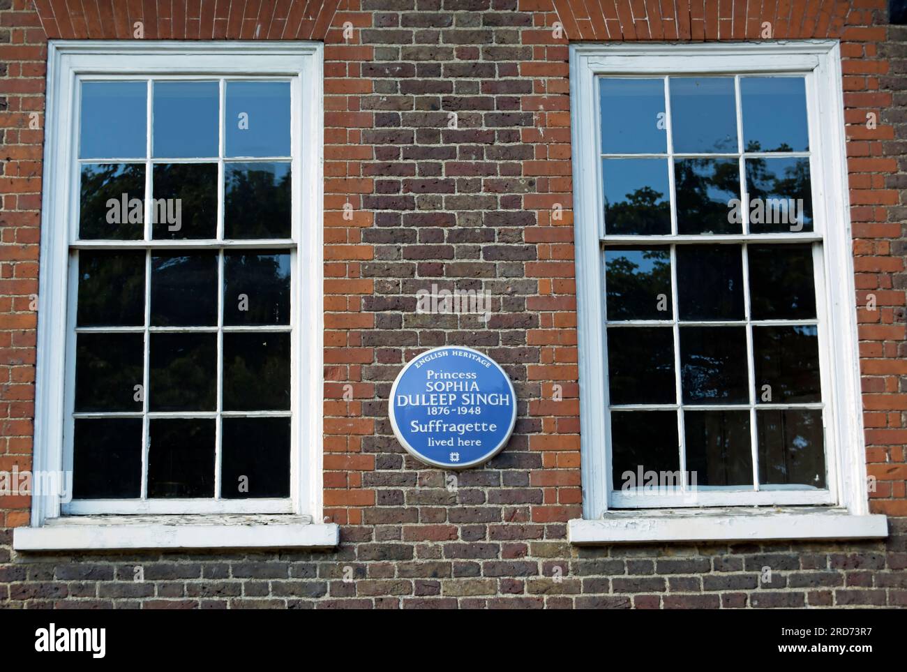 english heritage blue plaque marking a home of suffragette princess sophia duleep singh, faraday house, hampton court, london, england Stock Photo
