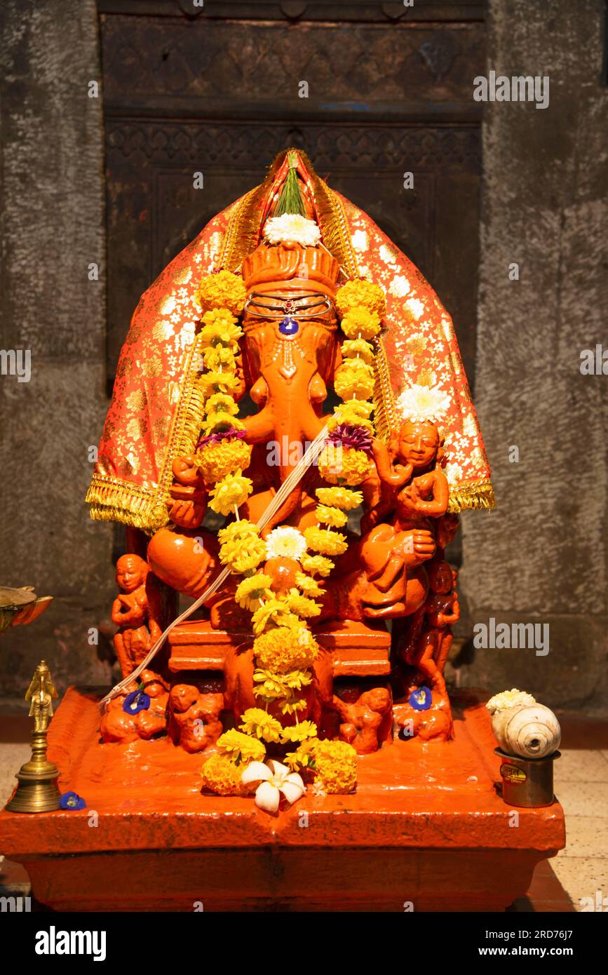 Pune Image of Trishund (meaning three trunks) Ganpati in shrine