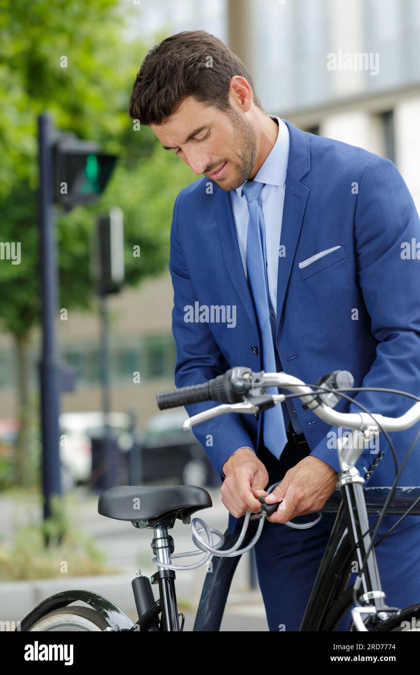 portrait of a successful businessman with bicycle Stock Photo