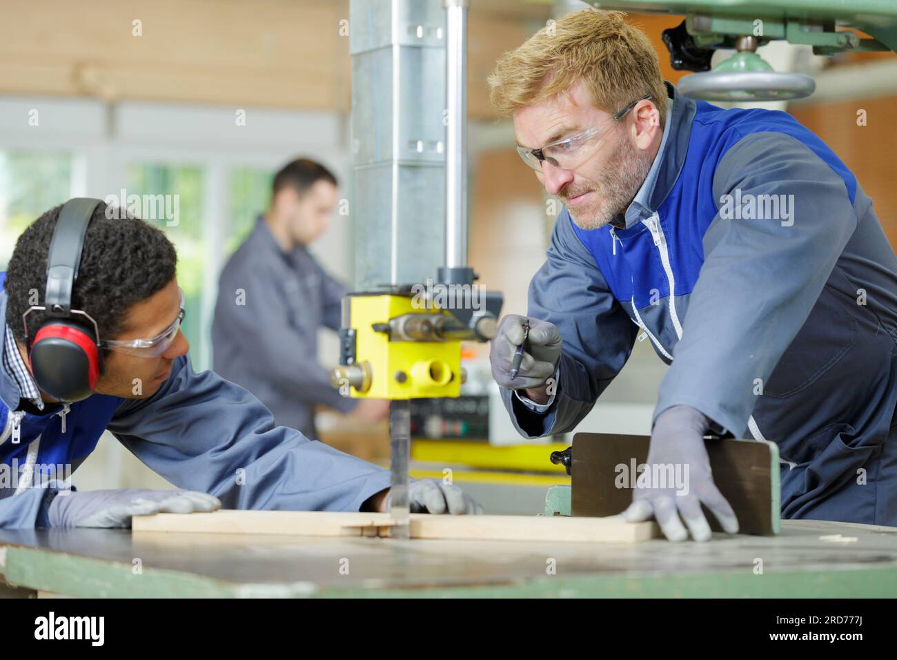 two confident carpenters are talking Stock Photo - Alamy
