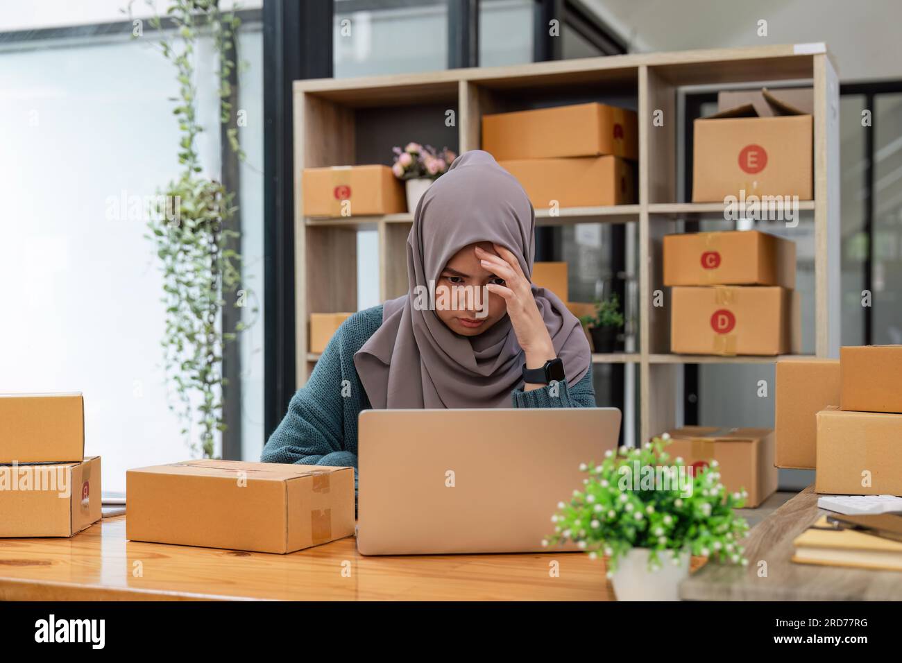 Stressed Muslim online business owner feeling upset sales and purchases