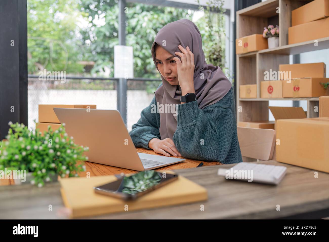 Stressed Muslim online business owner feeling upset sales and purchases