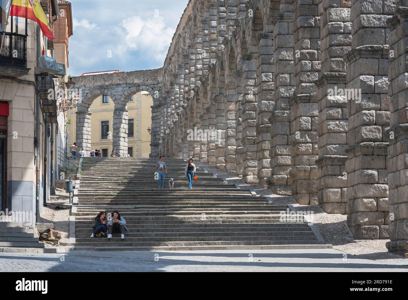 Segovia Spain aqueduct, view in summer of the grand stairway sited along the east side of the magnificent 1st Century AD Roman aqueduct in Segovia. Stock Photo