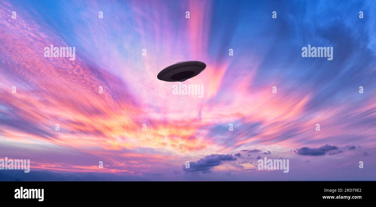 An Unidentified Flying Object Saucer Is Hovering In The Colored Surreal Sky Stock Photo