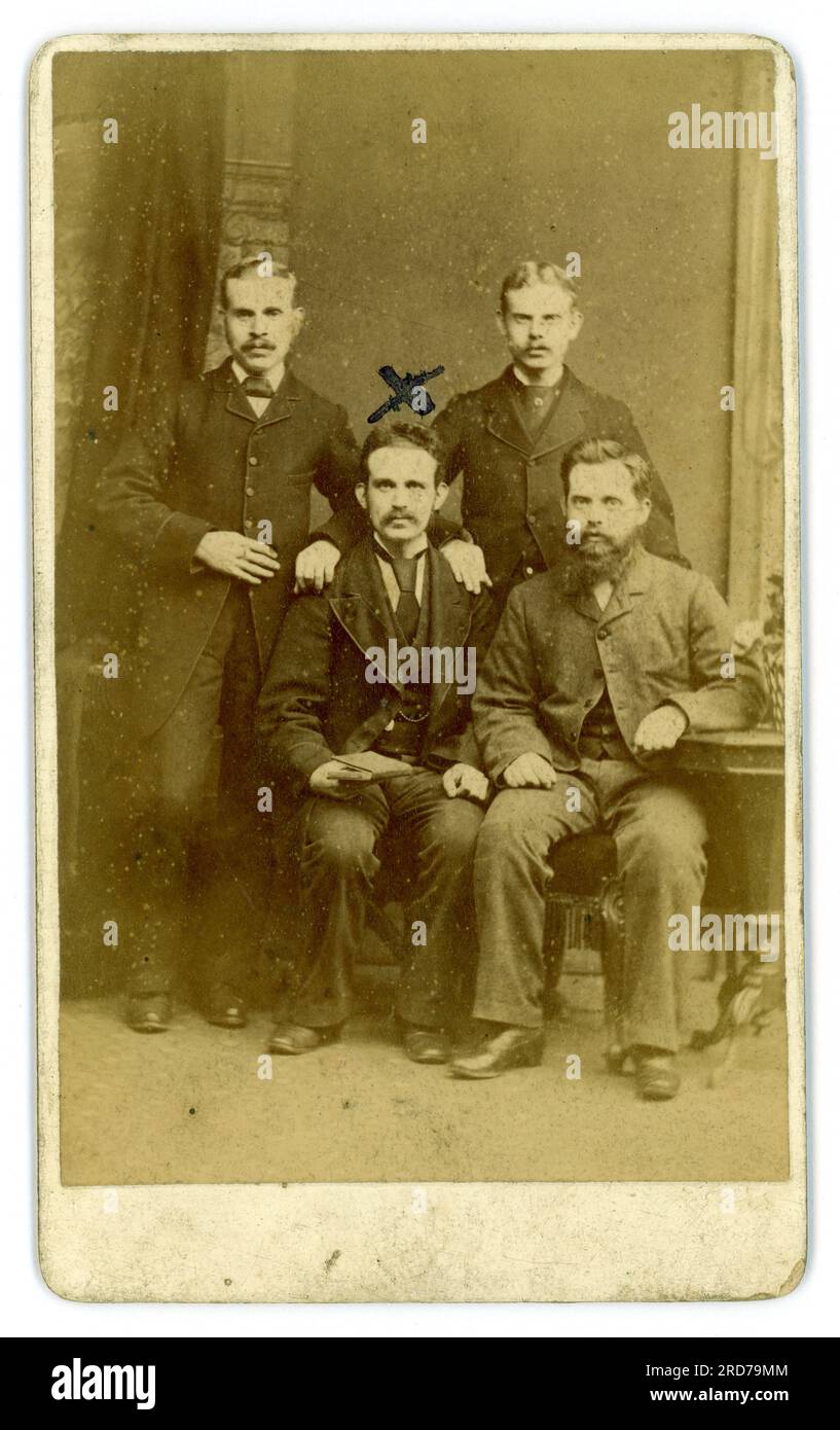 Reverse of Victorian CDV (carte de visite or visiting card) group of four men, possibly friends wearing suits, moustaches, from studio of Geo (George) Berry, 445 Southwark Park Road, Bermondsey, S.E. London, U.K.  circa 1880 to 1886. Stock Photo