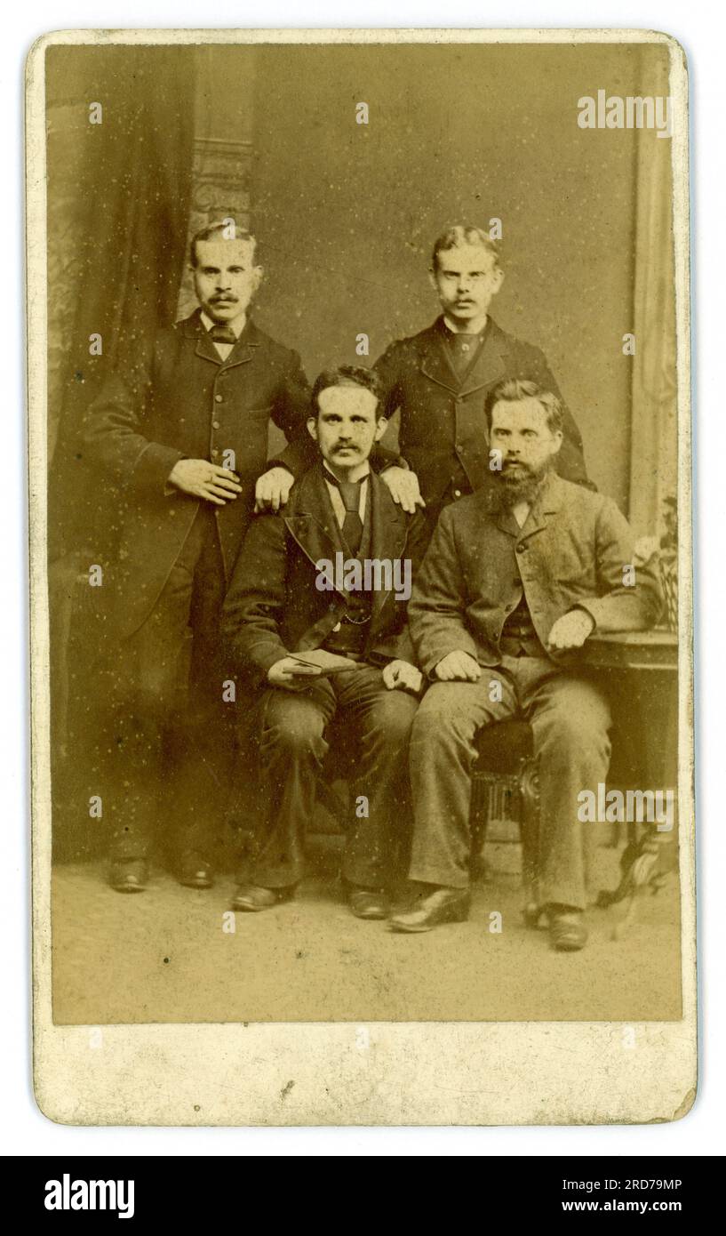 Reverse of Victorian CDV  group of four men,  friends with moustaches, from studio (carte de visite or visiting card)  of Geo (George) Berry, 445 Southwark Park Road, Bermondsey London directory..1880-86 . Stock Photo