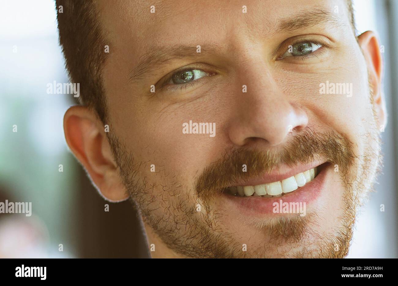Portrait of a handsome guy with white teeth Stock Photo