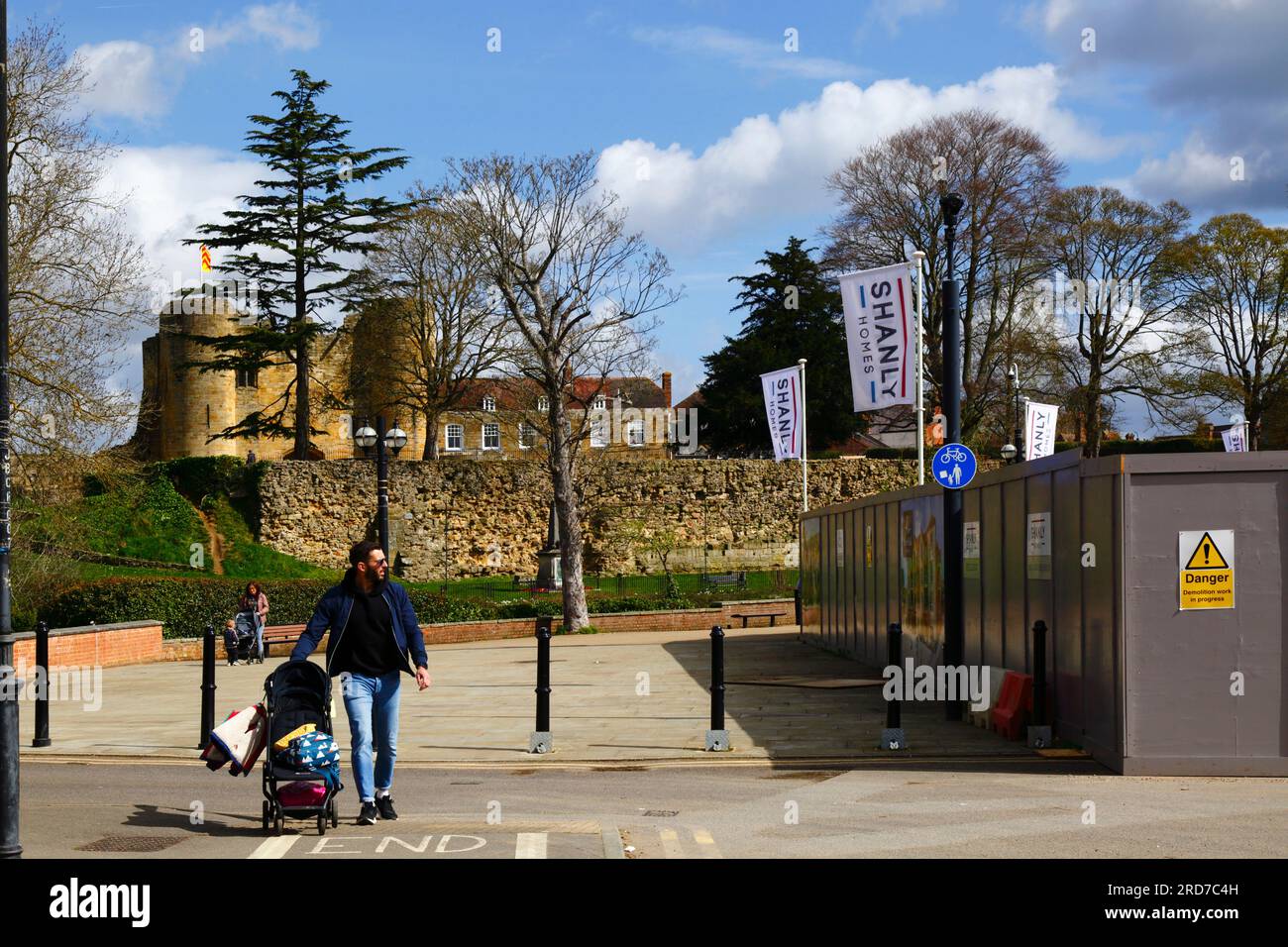 River Walk and corner of construction site for new Shanly Homes River Walk housing complex, castle gatehouse in background, Tonbridge, Kent, England Stock Photo