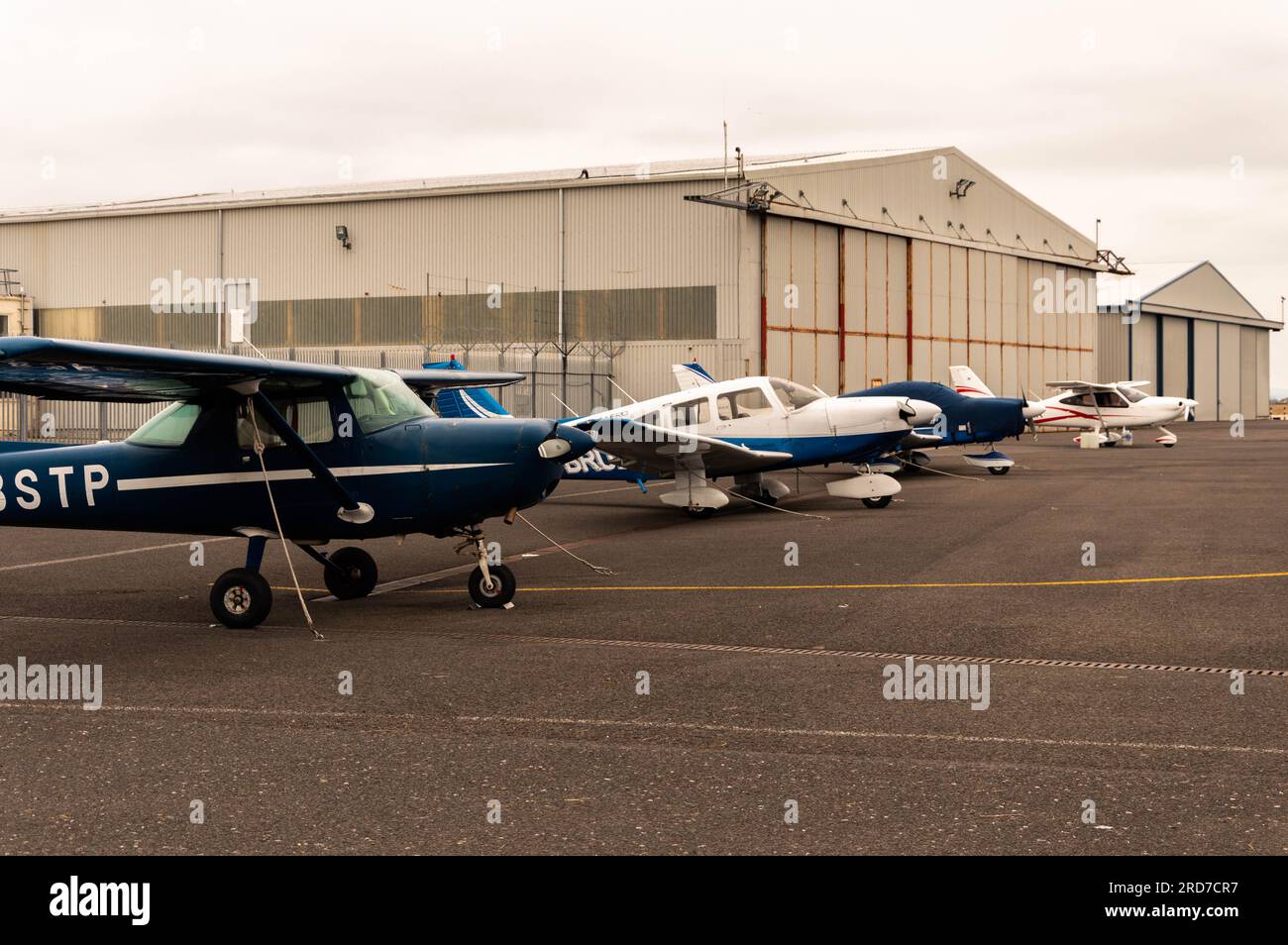 Small Planes Parked at Lydd Airport, Lydd, Kent, England Stock Photo