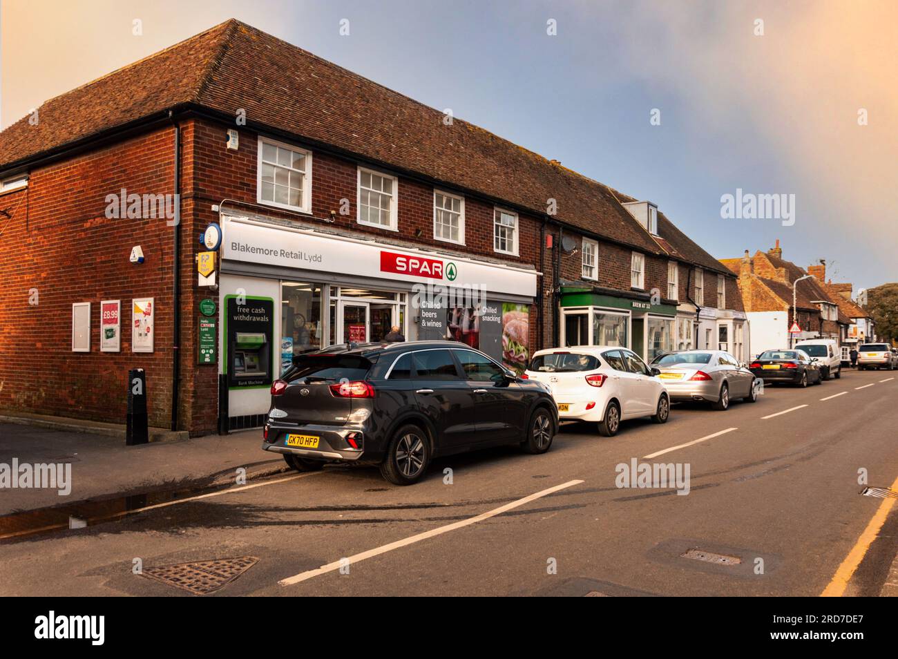 Cars Parked Outside Spar on Lydd High Street, Lydd, Kent, England Stock Photo