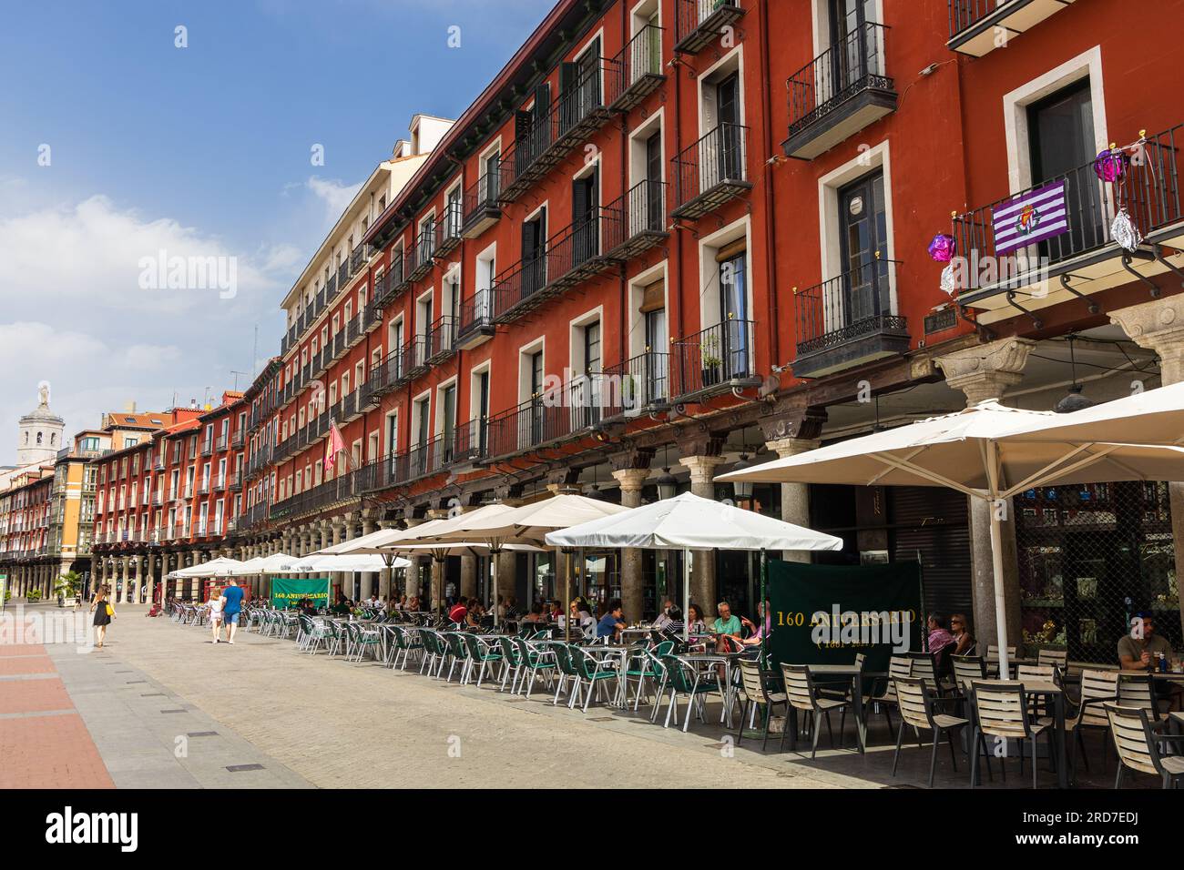View of Plaza Mayor, central square, with its historic beautiful red buildings during the sunny day. Valladolid, Castilla y León, Spain. Stock Photo