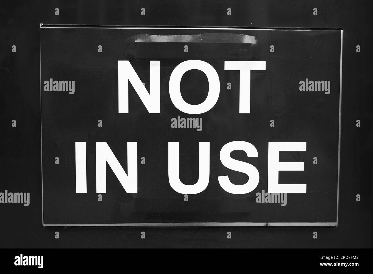 Not in Use sign, white font on black background Stock Photo