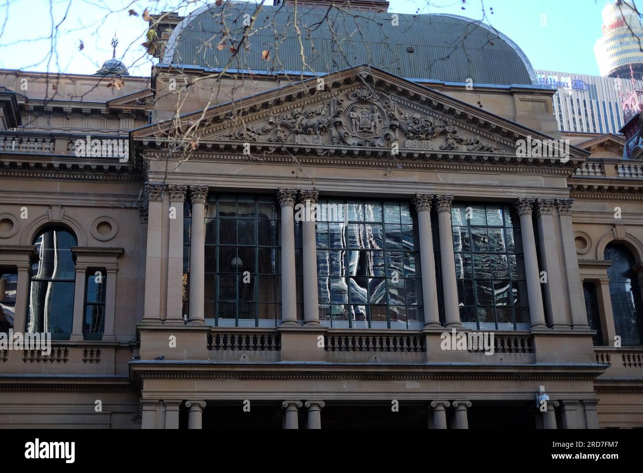 Sydney Town Hall Southern facade, enclosed balcony windows, columns, tympanum, entablature and frieze and enclosed balcony seen from Town Hall Square Stock Photo