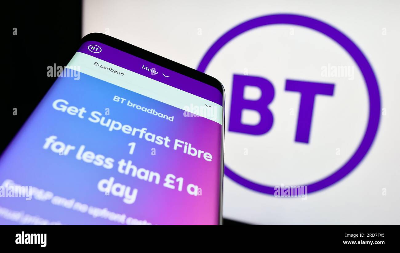 Mobile phone with web page of British company BT Group plc on screen in front