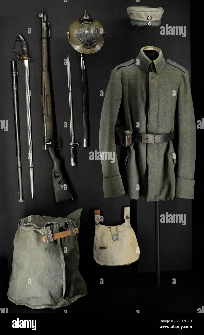 First World War (1914-1918). German Army. From left to right and from top to bottom: Infantry and technical unit officers and under-officers swords M 1889; Mauser carbine Kar.98 (a); bayonet M98; German army soldier field helmet; cap and tunic of a uniform of a soldier of German Army Prussian Jäger units; cavalry cloth bucket for horse watering and bread bag. Latvian War Museum. Riga. Latvia. Stock Photo