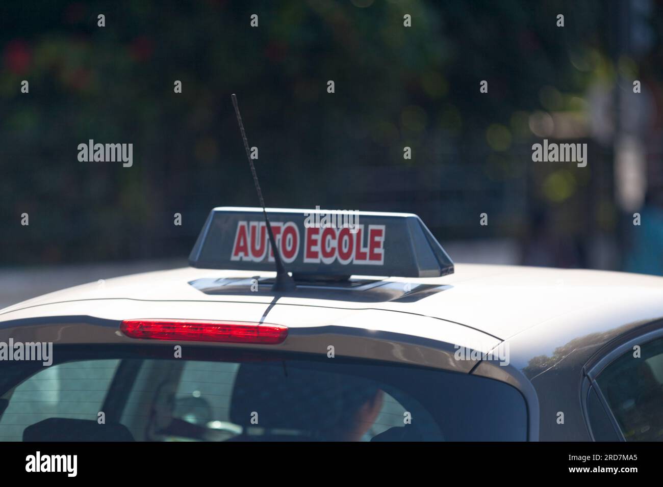 Car roof sign with written in it in French 'Auto-École', meaning in English 'Driving school'. Stock Photo