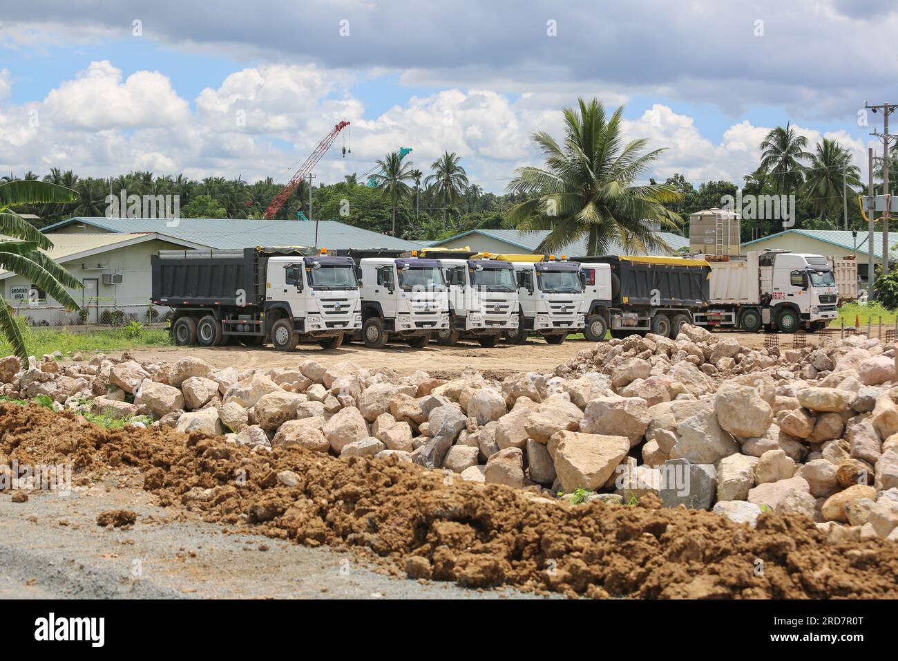 Tiaong, Philippines. July 19, 2023 : Work in progress on one of the biggest Philippine projects. Trucks supplying the silos from the quarry in the mountain. The South Luzon Expressway Toll Road 4 (SLEX Tr4) is part of the longest highway project in the country, which will connect Manila to Lucena initially, then to Matnog with the SLEX Tr5 project signed in 2022, which will connect the provinces of Quezon & Bicol via a 420 km road. Tuesday, Pres. Marcos signed a $9 billion sovereign wealth fund bill aimed at boosting economic growth, roads & infrastructure. Credit: Kevin Izorce/Alamy Live News Stock Photo