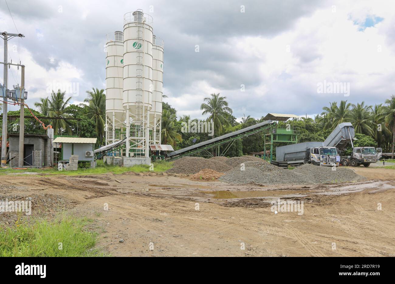 Tiaong, Philippines. July 19, 2023 : Work in progress on one of the biggest Philippine projects. Trucks supplying the silos from the quarry in the mountain. The South Luzon Expressway Toll Road 4 (SLEX Tr4) is part of the longest highway project in the country, which will connect Manila to Lucena initially, then to Matnog with the SLEX Tr5 project signed in 2022, which will connect the provinces of Quezon & Bicol via a 420 km road. Tuesday, Pres. Marcos signed a $9 billion sovereign wealth fund bill aimed at boosting economic growth, roads & infrastructure. Credit: Kevin Izorce/Alamy Live News Stock Photo